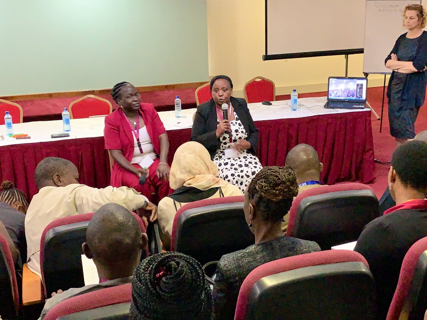 Photo of two african American Females speaking at Kenyatta University Class